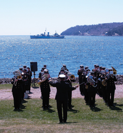 The ceremony at Point Pleasant Park in Halifax proceeds with HMCS Sackville a short distance away. [PHOTO: VETERANS AFFAIRS CANADA]