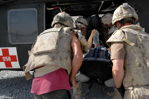 Medical staff load a Canadian soldier into a helicopter. [CANADIAN FORCES COMBAT CAMERA]