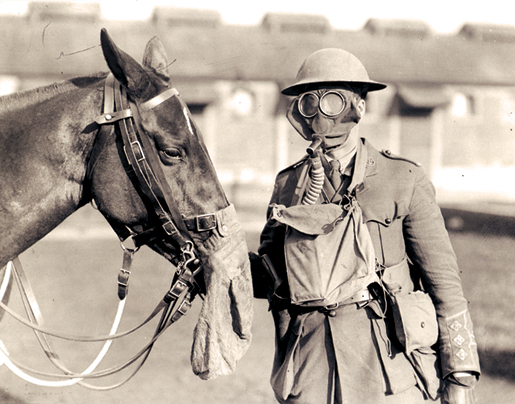 A member of the Canadian Army Veterinary Corps trains for a gas attack. [PHOTO: LIBRARY AND ARCHIVES CANADA—PA005001]