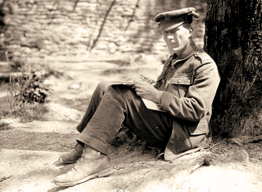 Writing home in July 1916. [PHOTO: LIBRARY AND ARCHIVES CANADA—PA000405]