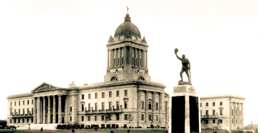 The Golden Boy statue sits atop the Manitoba Legislative Building while a First World War memorial (foreground) is a reminder of war’s cost. [PHOTO: ARCHIVES OF MANITOBA—N16379]