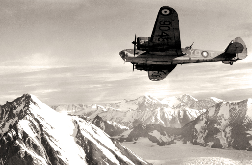 An aircraft of No. 8 Sqdn. on patrol over snow-capped mountains. [PHOTO: CANADIAN FORCES—RE20468]