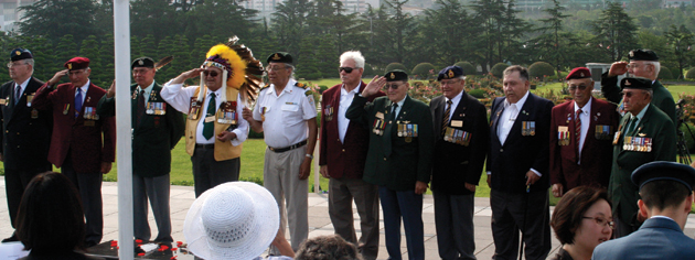 Aboriginal and Métis veterans representatives join in a sunrise ceremony at the United Nations Memorial Cemetery. [PHOTO: TOM MACGREGOR]