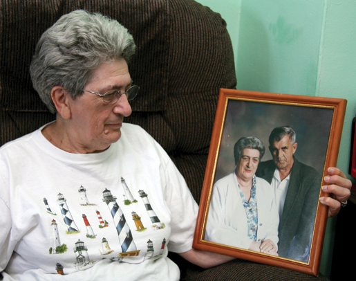 Lorraine Chace with a portrait  of Bill, her husband of 50 years.  Bill died before applying for the full menu of VIP benefits, and  she can’t apply for them herself. [PHOTO: SHARON ADAMS]