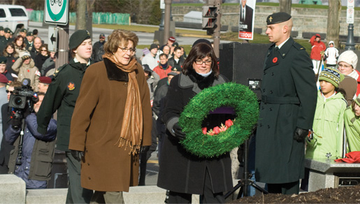 Silver Cross Mother Elsie Godin (left) prepares to place a wreath. [PHOTO: TOM MacGREGOR]