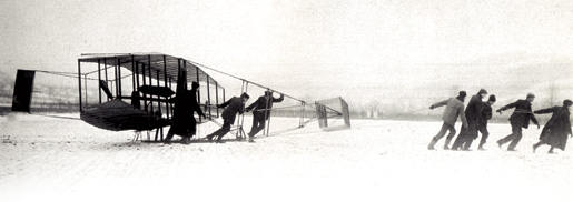 The Silver Dart is pulled out onto the ice for trials in December 1908. [PHOTO: LIBRARY AND ARCHIVES CANADA—PA122520]