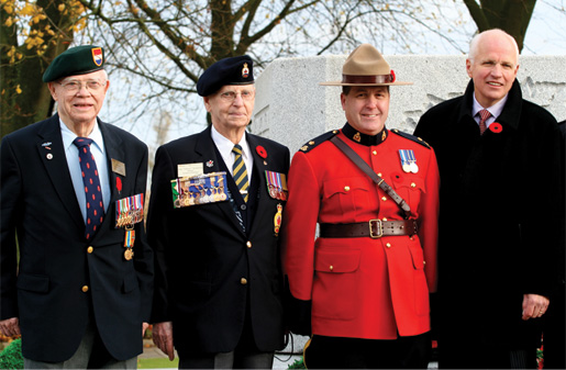 Second World War veterans Bill Story and John Henderson join Inspector Yvon de Champlain and Veterans Affairs Minister Greg Thompson. [PHOTO: SHARON ADAMS]