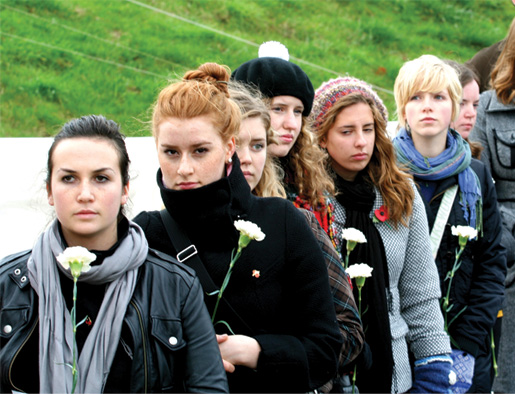 Students with flowers at Vimy ceremony. [PHOTO: SHARON ADAMS]
