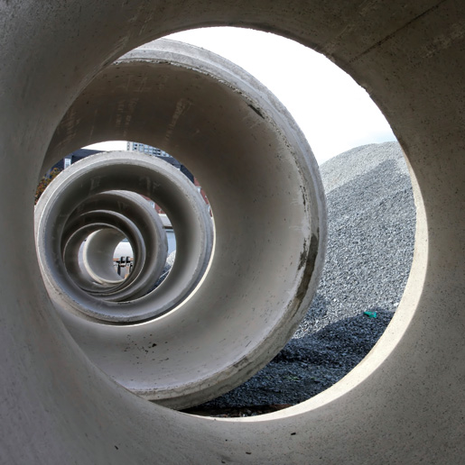 Huge sections of pipe await installation. [PHOTO: ©iStockphoto/kozmoat98]