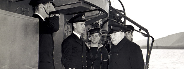 British Prime Minister Winston Churchill (right) visits HMCS Assiniboine, August 1941. [PHOTO: KEN BELL, NATIONAL DEFENCE/LIBRARY AND ARCHIVES CANADA—PA140559]