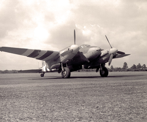 A Mosquito with D-Day markings. [PHOTO: DEPARTMENT OF NATIONAL DEFENCE, LIBRARY AND ARCHIVES CANADA—PA175168]