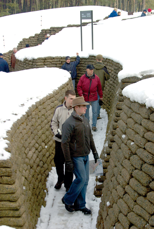 officer cadets from the Royal Military College examine a restored trench at Vimy Ridge in France. [PHOTO: ADAM DAY]