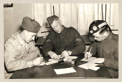 Soldiers write home in January 1941. [PHOTO: WILLIAM KENSIT, EDMONTON]