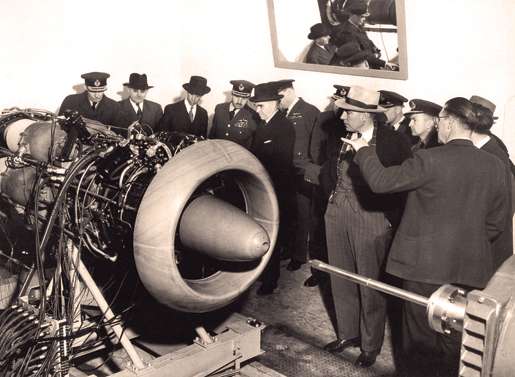RCAF officers and other officials examine a Chinook jet engine, March 1948. [PHOTO: LIBRARY AND ARCHIVES CANADA—PA121835]