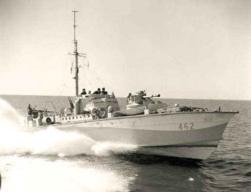 Motor Torpedo Boat 462 races into action, 1944. [PHOTO: GILBERT MILNE, LIBRARY AND ARCHIVES CANADA—PA144574]