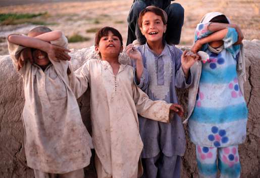 Some local kids play for the camera. [PHOTO: ADAM DAY]