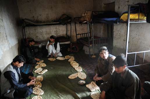 Members of the Afghan border police prepare to eat in their barracks at Spin Boldak. [PHOTO: MATTHIEU AIKINS]