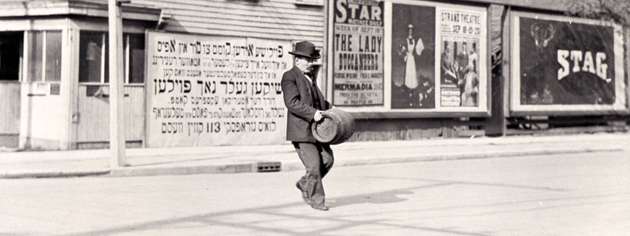A man carries a keg during prohibition, September 1916. [PHOTO: JOHN BOYD, LIBRARY AND ARCHIVES CANADA—PA069965]