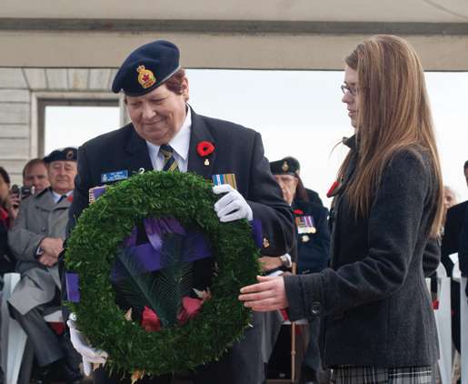 Legion First Vice Pat Varga places a wreath at the Cassino War Cemetery assisted by youth representative Mélanie Morin. [PHOTO: TOM MacGREGOR]