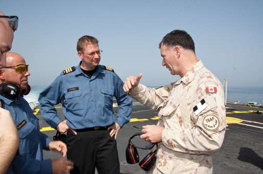 Commander Steven Waddell (centre) chats with Lieutenant-General Marc Lessard, commander of Canadian Expeditionary Force Command. [PHOTO: DAN BLACK]