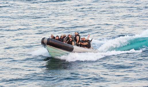 The naval boarding party returns to HMCS Fredericton following a practice drill. [PHOTO: DAN BLACK]