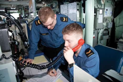 Leading seamen Mike Power (left) and Brendon Pretty on  the bridge. [PHOTO: DAN BLACK]