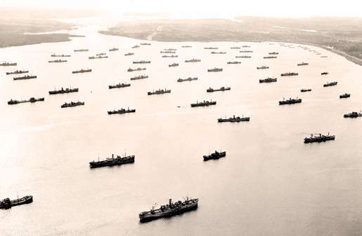 Merchant ships  assemble  in Bedford Basin, Halifax, April 1942. [PHOTO: LIBRARY AND ARCHIVES CANADA—PA112993]