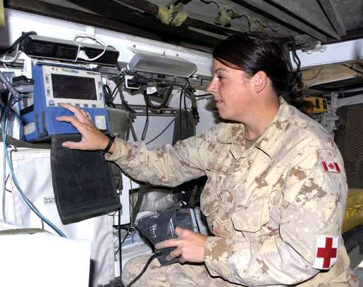 A medical technician checks equipment in the wartorn country. [PHOTO: COMBAT CAMERA]