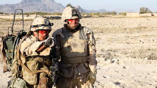 Sgt. Dwayne MacDougall (left) points out local sights to Major Ryan Jurkowski. [PHOTO: ADAM DAY]