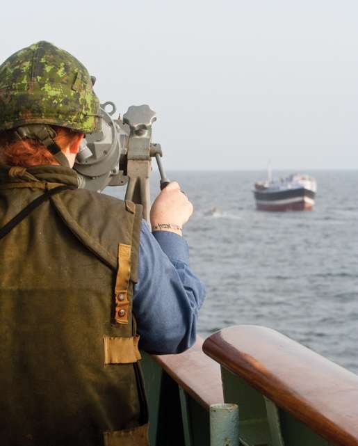 A sailor practices firing one of the ship’s .50-calibre machine-guns. [PHOTO: DAN BLACK]