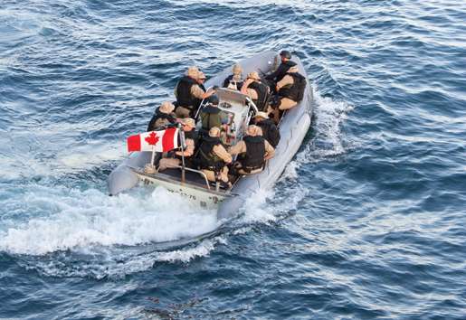 HMCS Fredericton’s boarding party heads off in the RHIB to investigate a dhow. [PHOTO: DAN BLACK]