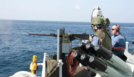 A sailor practices firing one of the ship’s .50-calibre machine-guns. [PHOTO: DAN BLACK]