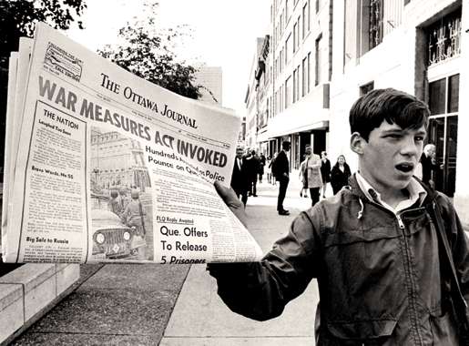 A newsboy hits the streets in Ottawa, Oct. 16, 1970. [PHOTO: PETER BREGG, THE CANADIAN PRESS]