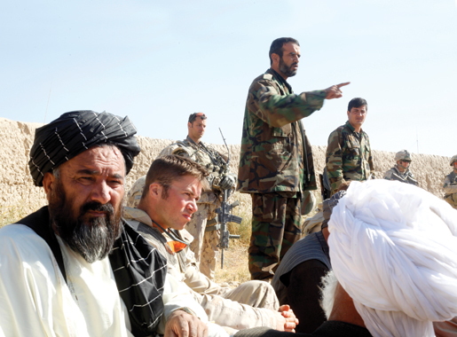 Lieutenant Saed delivering his speech as (foreground) Captain Talsma and Hajji Baran listen. [PHOTO: ADAM DAY]