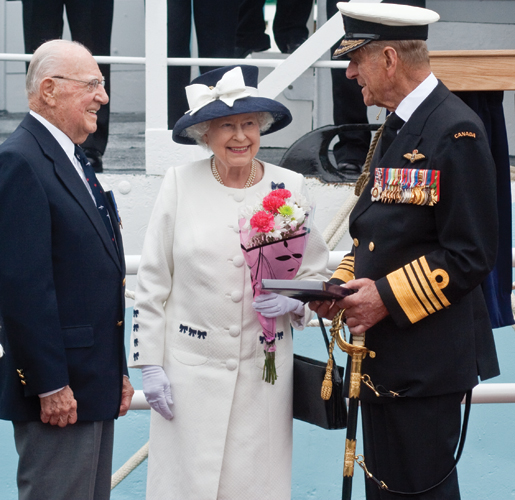 Former corvette commander Murray Knowles greets the Queen and Prince Philip. [PHOTO: TOM MacGREGOR]