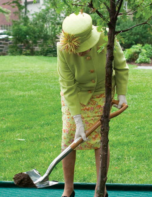 The Queen plants an English oak at Government House. [PHOTO: TOM MacGREGOR]
