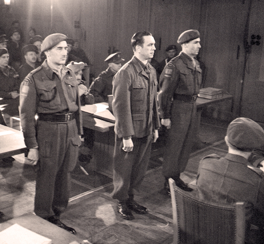 Kurt Meyer (centre) on trial, December 1945. [PHOTO:  BARNEY J. GLOSTER, LIBRARY AND ARCHIVES CANADA—PA141890]