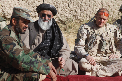 Major Ryan Jurkowski (right) and Lieutenant Saed (left) sit with one of Salavat’s elders during the final Shura. [PHOTO: ADAM DAY]