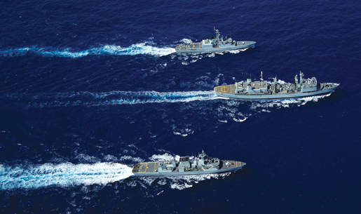 The Canadian Operational Support Ship, HMCS Protecteur (below centre) is flanked by HMCS Iroquois (2nd) (top) and HMCS Calgary (2nd) during a counter-drug operation in the Caribbean in 2008. [PHOTO: CANADIAN FORCES]
