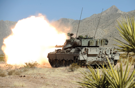 A Leopard tank blasts away at a target during a training exercise involving members of the Lord Strathcona’s Horse and Royal 22nd Regiment at Fort Bliss, Texas. [PHOTO: CORPORAL MARC-ANDRE GAUDREAULT, PHOTO SECTION CFB VALCARTIER]