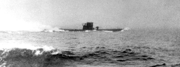 German U-boat U-210 under attack in the Atlantic. The photo was taken from the deck of HMCS Assiniboine, August 1942. [PHOTO: G.E. SALTER, LIBRARY AND ARCHIVES CANADA—PA037443]