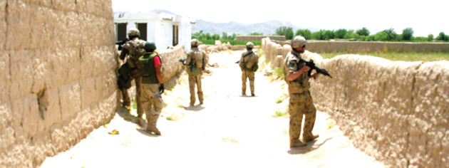 Near Zangabad in 2008 as a Canadian patrol dares to go no further into enemy territory. [PHOTO: ADAM DAY]