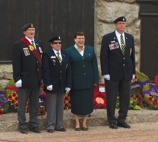 Joining VAC’s Arlene King at the Beaumont Hamel Memorial are Newfoundlanders (from left) Silas and Jacqueline Thompson and Ed Fewer. [PHOTO: TOM MacGREGOR]