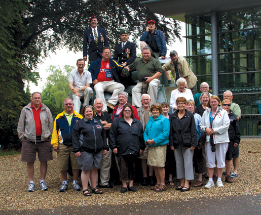 The group poses with a Sherman tank at Oosterbeek. [PHOTO: TOM MacGREGOR]