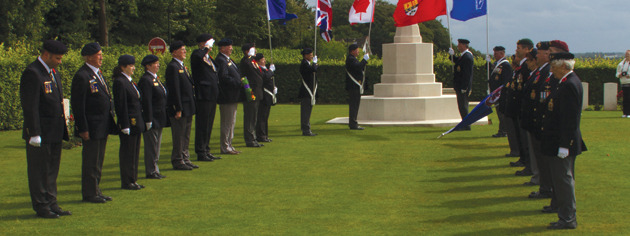 The pilgrims form up at the Dieppe Canadian War Cemetery. [PHOTO: TOM MacGREGOR]
