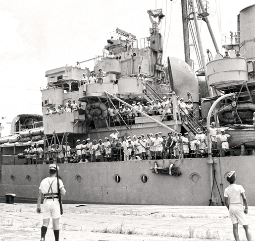 Sailors crowd the decks of HMCS Prince Robert after the ship arrives in Hong Kong, August 1945. [PHOTOS: CANADIAN WAR MUSEUM—2002 0045-2772]