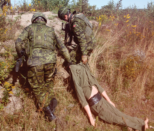 Dragging a wounded man (mannequin) to safety. [PHOTO: ADAM DAY]