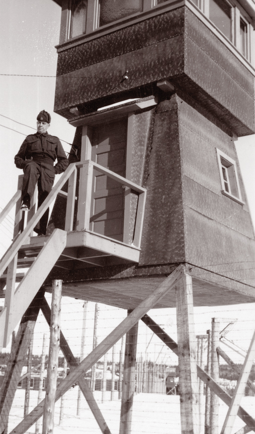 A member of the Veterans Guard of Canada mans his position at a guard tower in Monteith, Ont. [PHOTO: CANADIAN WAR MUSEUM—20050128-017]