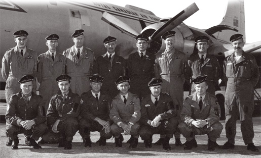 Canadian airmen with French naval aviators in front of an Argus aircraft.