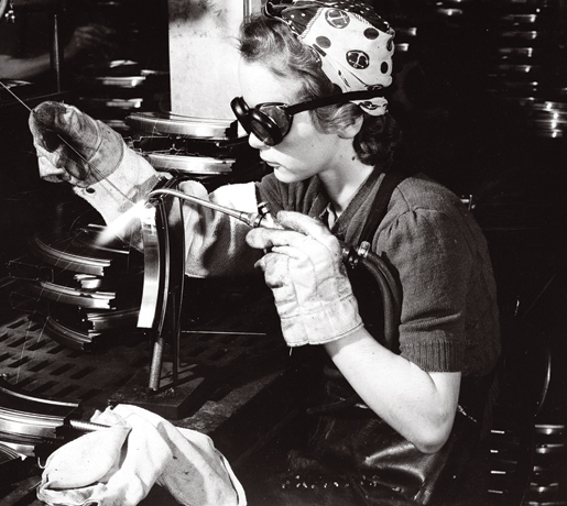 A welder works on a Bren gun at John Inglis Company Ltd., 1942.